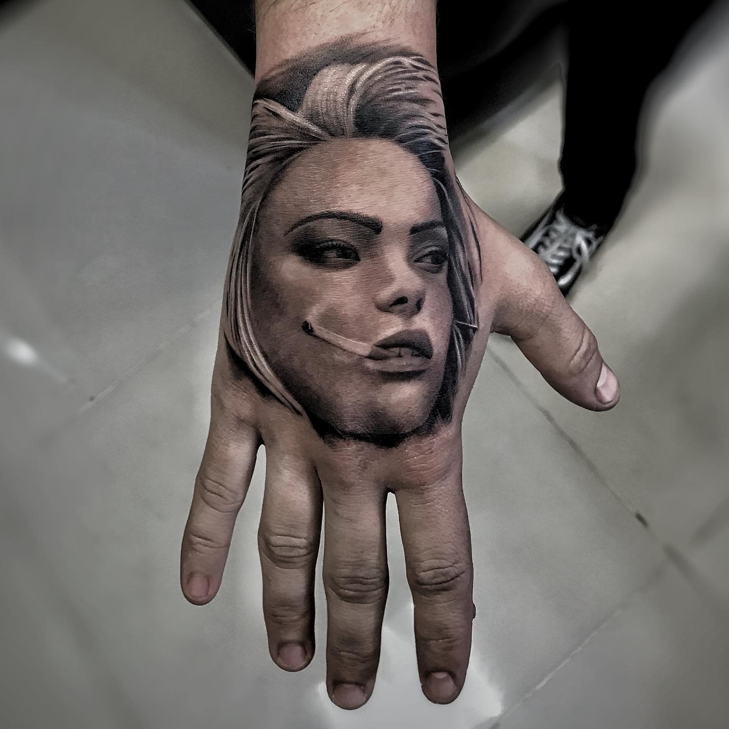 Custom geometric tattoo design on upper arm