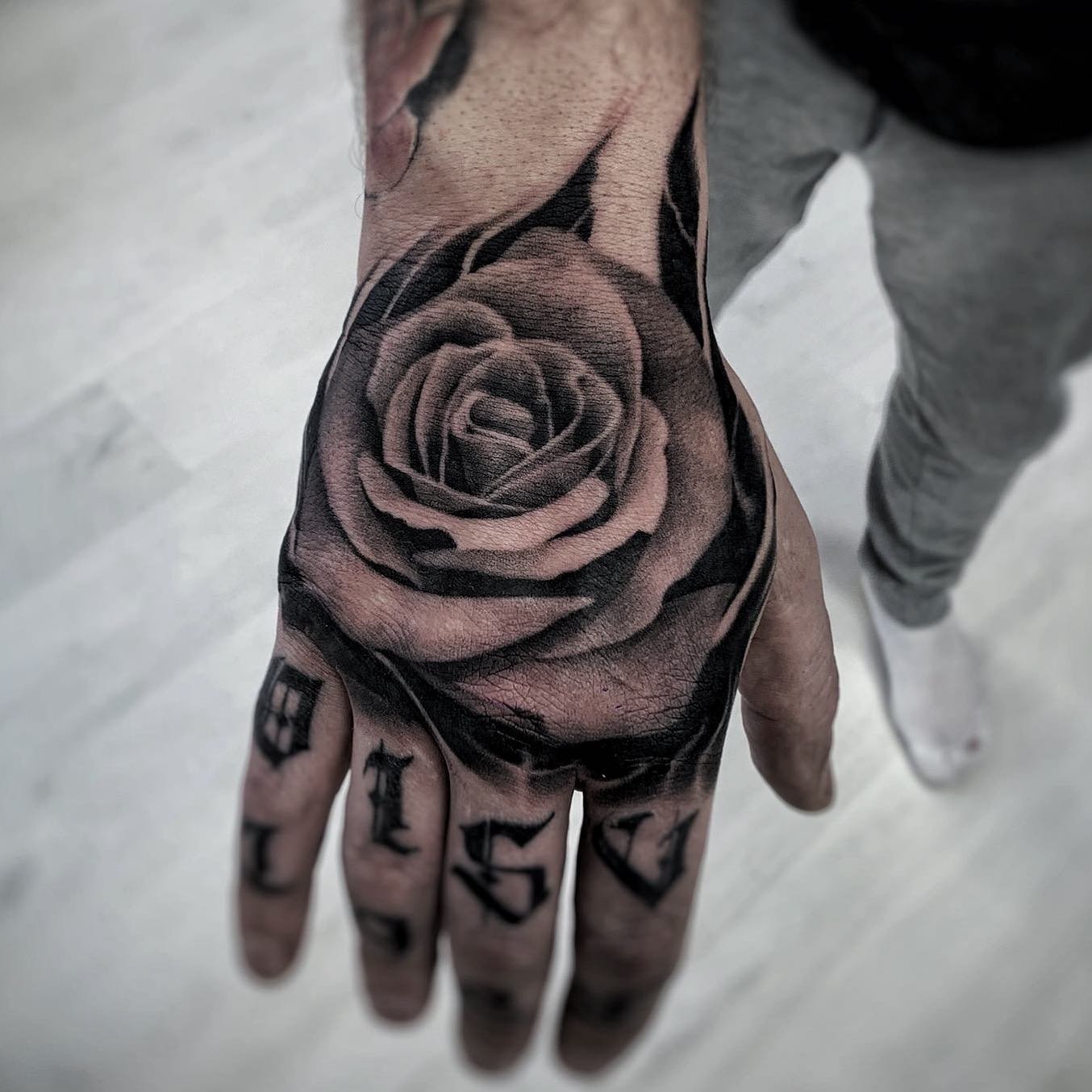 Realistic black and grey portrait tattoo