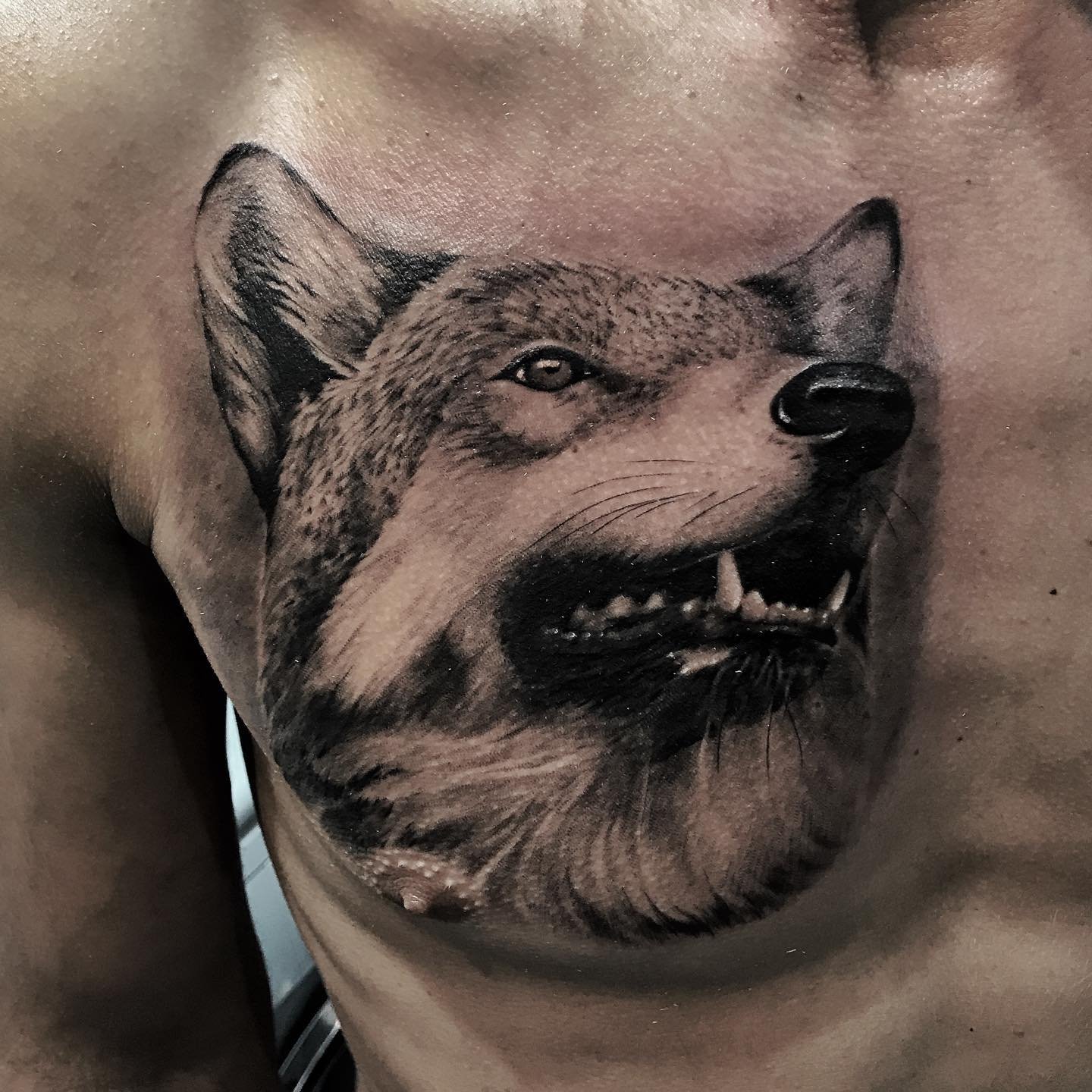 Realistic black and grey portrait tattoo